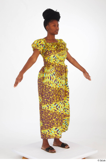 Dina Moses A poses dressed standing whole body yellow long…